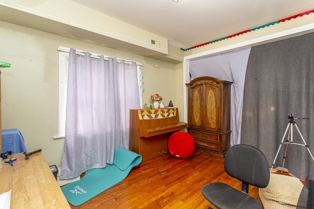 interior space featuring wood finished floors and visible vents