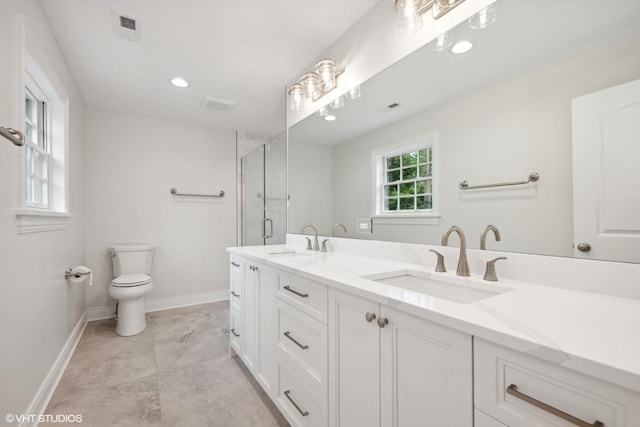 full bathroom featuring a stall shower, visible vents, a sink, and toilet