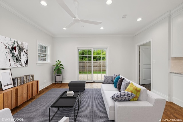 living room with recessed lighting, wood finished floors, a ceiling fan, baseboards, and crown molding