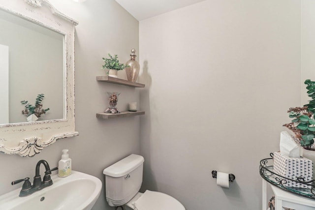 bathroom featuring a sink and toilet