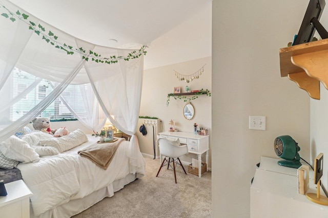 bedroom featuring light carpet