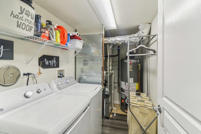 laundry area featuring laundry area, washer and clothes dryer, gas water heater, and wood finished floors