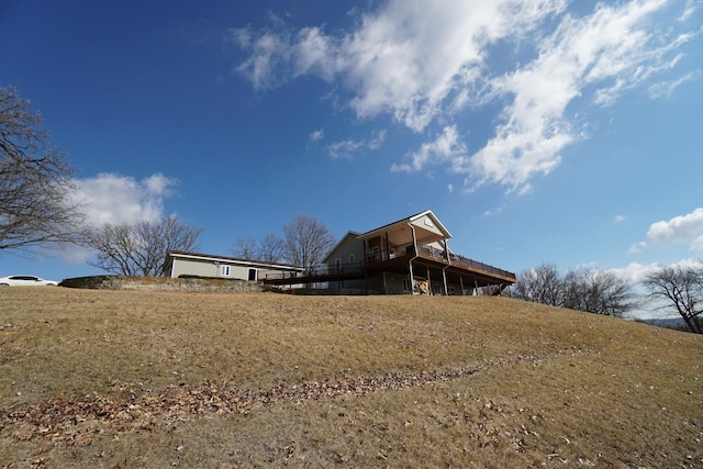 back of house with a wooden deck