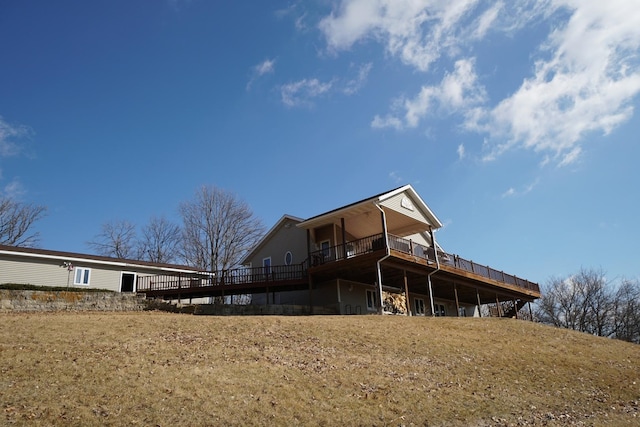 rear view of house with a wooden deck