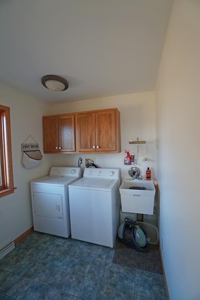 laundry room with cabinet space, baseboards, separate washer and dryer, and a baseboard heating unit