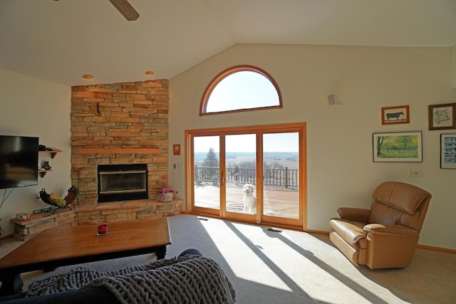 carpeted bedroom with access to exterior, a fireplace, a ceiling fan, high vaulted ceiling, and baseboards