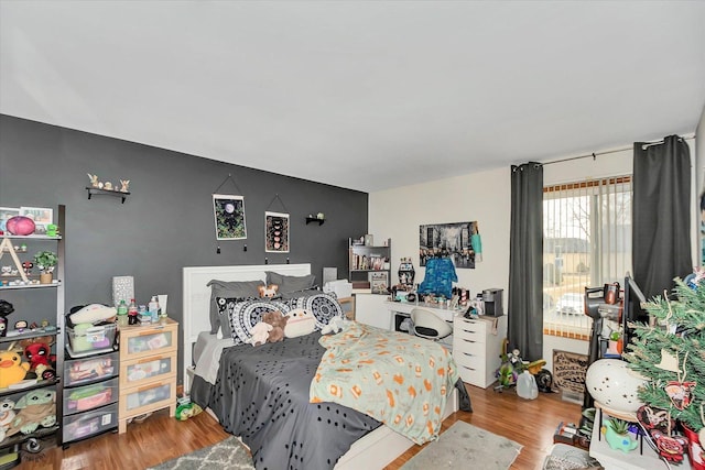 bedroom with wood finished floors