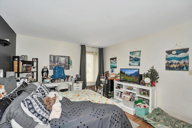 bedroom featuring wood finished floors