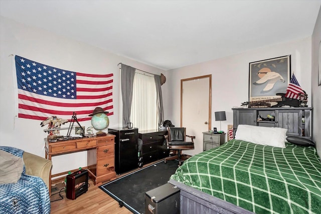 bedroom with wood finished floors