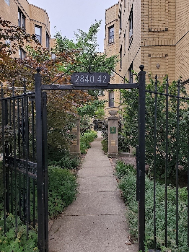 view of gate with fence