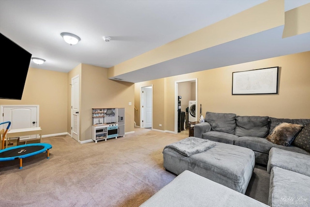 living room with light carpet and baseboards