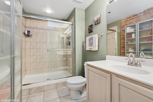 full bathroom with vanity, tile patterned flooring, a shower stall, and toilet