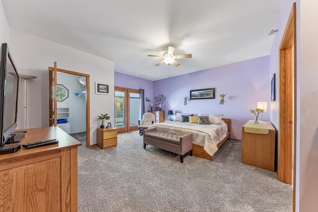 bedroom featuring light carpet and ceiling fan