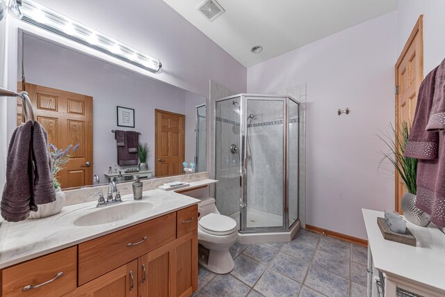 bathroom featuring toilet, a shower stall, visible vents, and vanity