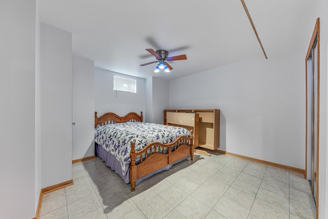 bedroom with light tile patterned flooring, a ceiling fan, and baseboards