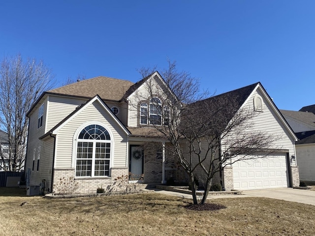 traditional home with a garage, concrete driveway, and brick siding