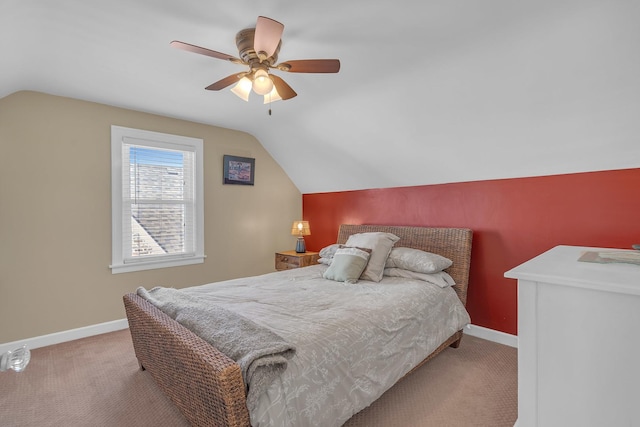 bedroom featuring baseboards, lofted ceiling, and carpet flooring