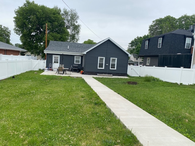 225 W Dakota St, Spring Valley, IL 61362 - back of property with a patio area and a shingled roof