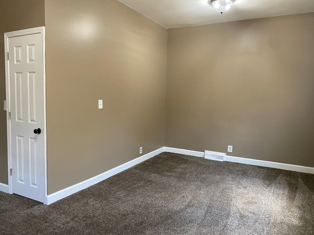 225 W Dakota St, Spring Valley, IL 61362 - unfurnished room with dark carpet and baseboards
