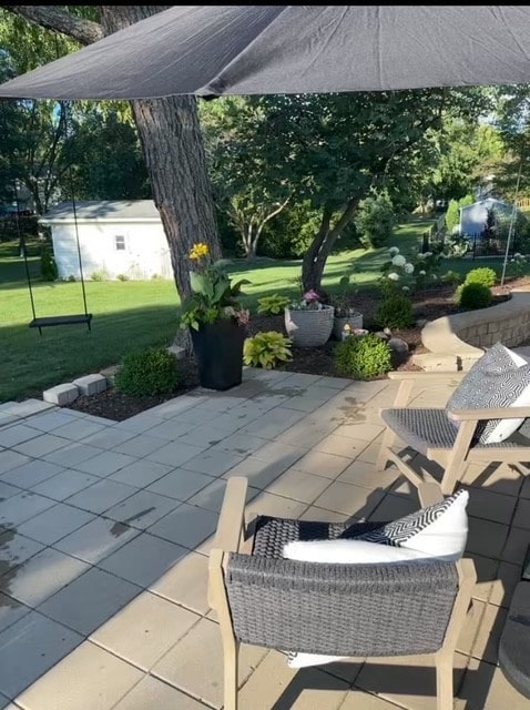 view of patio / terrace featuring an outbuilding