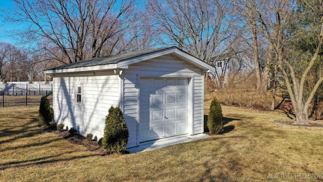 view of outbuilding with an outdoor structure and fence