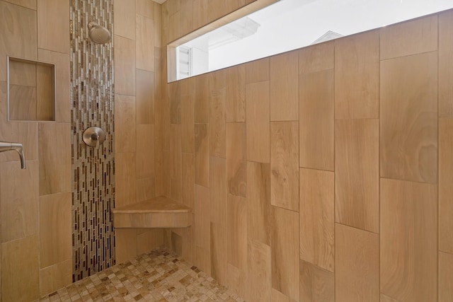 bathroom with tiled shower