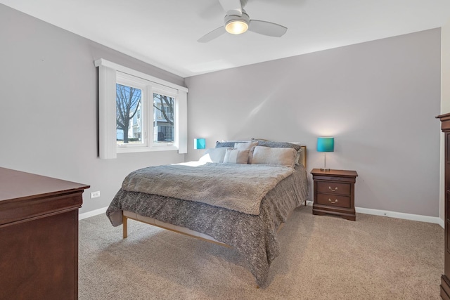 carpeted bedroom featuring a ceiling fan and baseboards