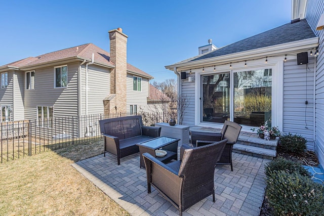 view of patio featuring outdoor lounge area and fence