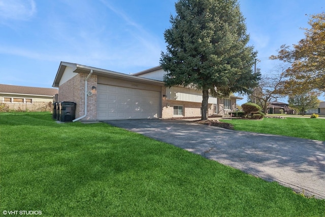 view of front facade with driveway, a front yard, a garage, and brick siding