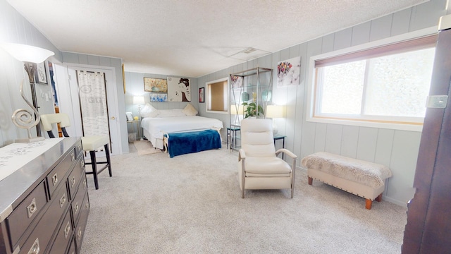 carpeted bedroom featuring a textured ceiling