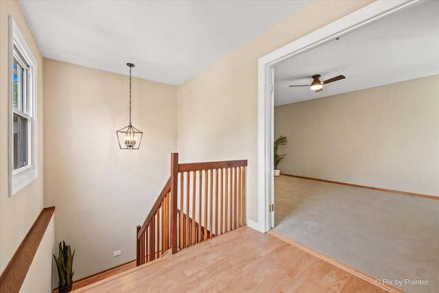 924 Colony Lake Dr, Schaumburg, IL 60194 - stairs with a chandelier, wood finished floors, and a ceiling fan