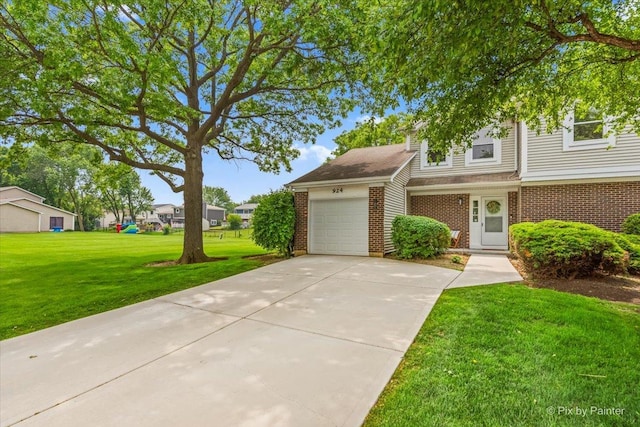 924 Colony Lake Dr, Schaumburg, IL 60194 - view of front of property featuring brick siding, an attached garage, driveway, and a front lawn