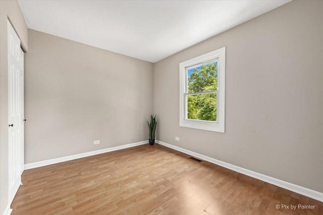 924 Colony Lake Dr, Schaumburg, IL 60194 - empty room featuring baseboards and light wood-style floors