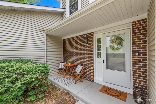 924 Colony Lake Dr, Schaumburg, IL 60194 - doorway to property featuring brick siding and a porch