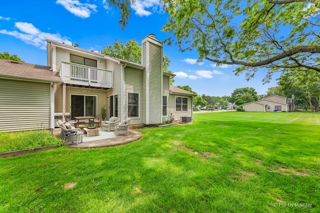 924 Colony Lake Dr, Schaumburg, IL 60194 - back of house with a balcony, a chimney, a lawn, a patio area, and an outdoor hangout area