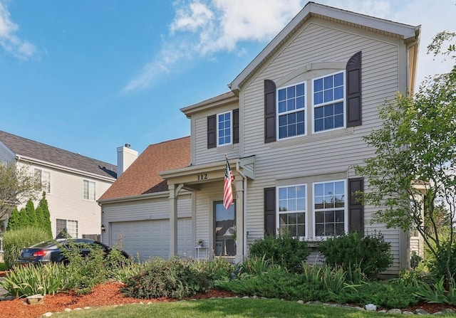 traditional home featuring an attached garage