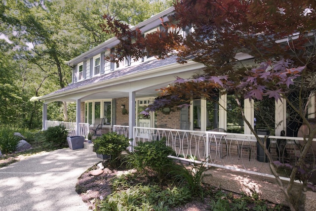 14930 W Wadsworth Rd, Wadsworth, IL 60083 - view of front facade featuring a porch and brick siding