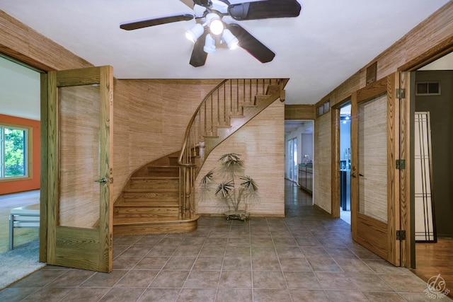 14930 W Wadsworth Rd, Wadsworth, IL 60083 - stairs featuring a ceiling fan and wooden walls