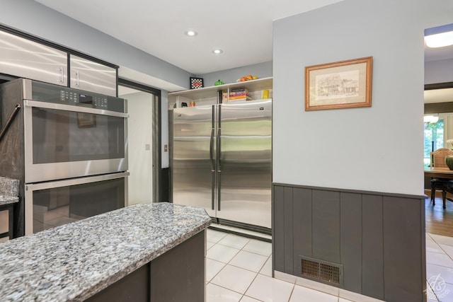 14930 W Wadsworth Rd, Wadsworth, IL 60083 - kitchen featuring stainless steel appliances, light tile patterned flooring, light stone countertops, and recessed lighting
