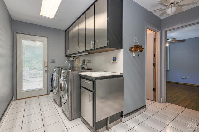 14930 W Wadsworth Rd, Wadsworth, IL 60083 - washroom featuring cabinet space, a ceiling fan, separate washer and dryer, and light tile patterned floors