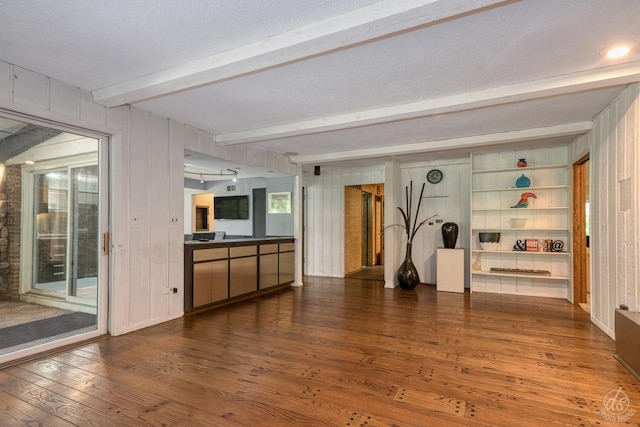 14930 W Wadsworth Rd, Wadsworth, IL 60083 - unfurnished living room featuring hardwood / wood-style flooring, beam ceiling, and wooden walls