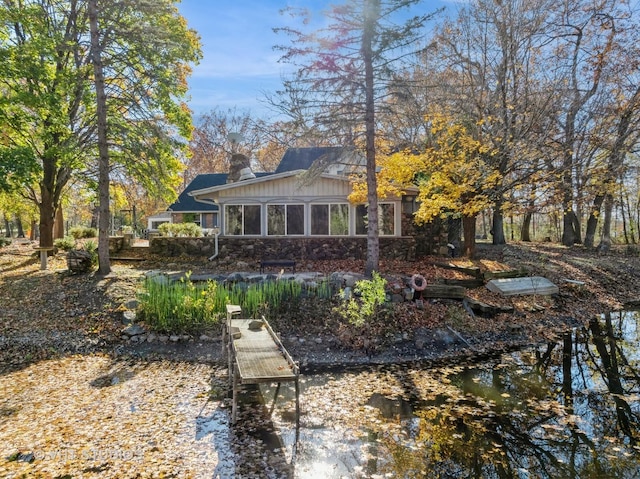 14930 W Wadsworth Rd, Wadsworth, IL 60083 - back of house featuring board and batten siding and stone siding