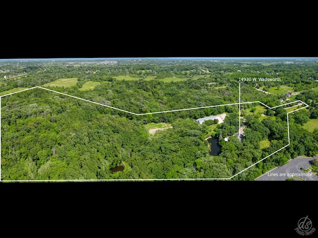 14930 W Wadsworth Rd, Wadsworth, IL 60083 - aerial view of property and surrounding area featuring a heavily wooded area and property boundaries highlighted