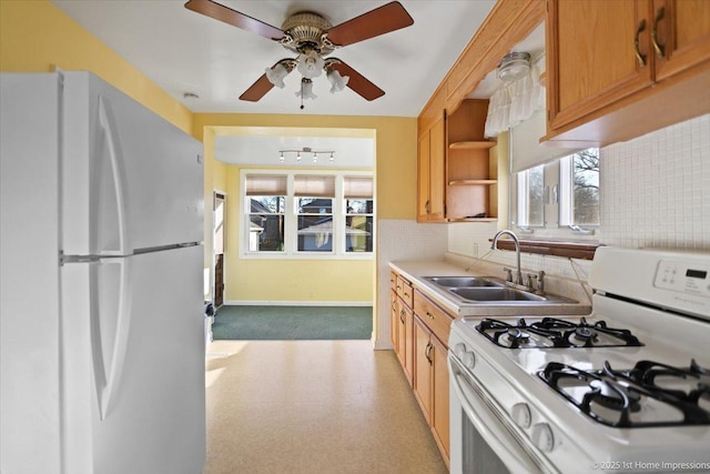 kitchen with open shelves, light countertops, backsplash, a sink, and white appliances