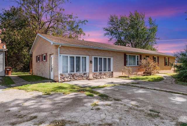 view of front of home featuring brick siding