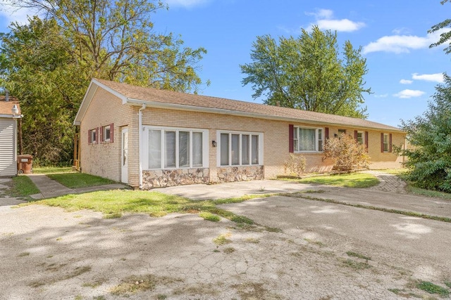 ranch-style house with brick siding