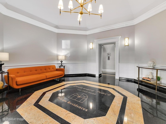community lobby featuring wainscoting, crown molding, and a decorative wall