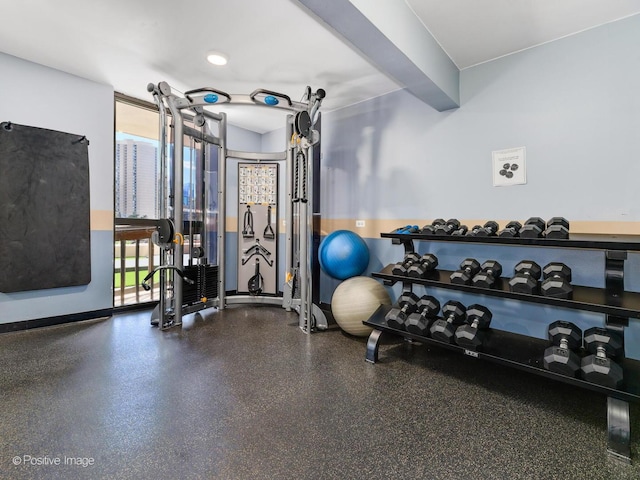 gym featuring baseboards
