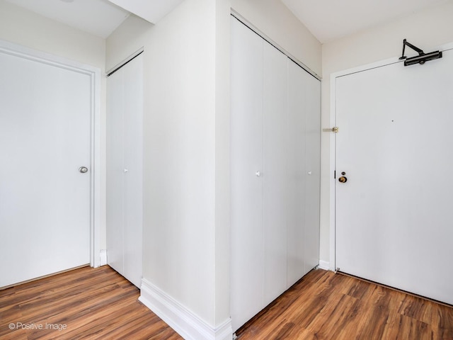 hall featuring wood finished floors