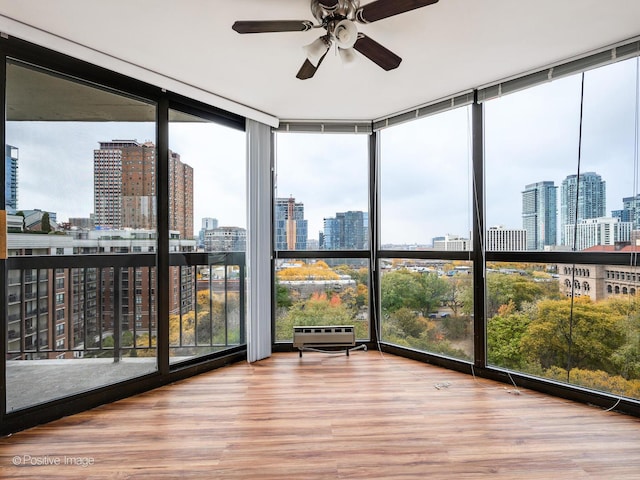 unfurnished sunroom featuring a skyline view